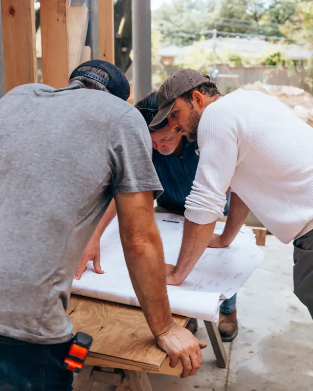 Crew reviewing drawings on a job site