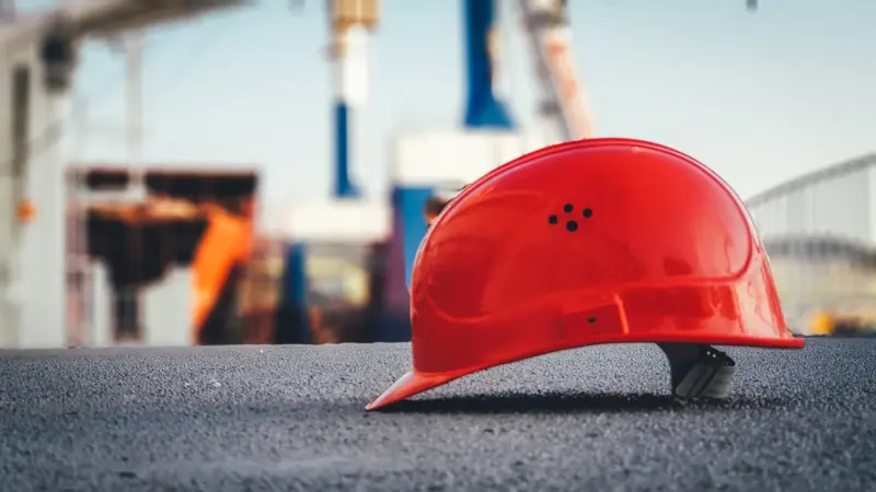 Red hard hat on site
